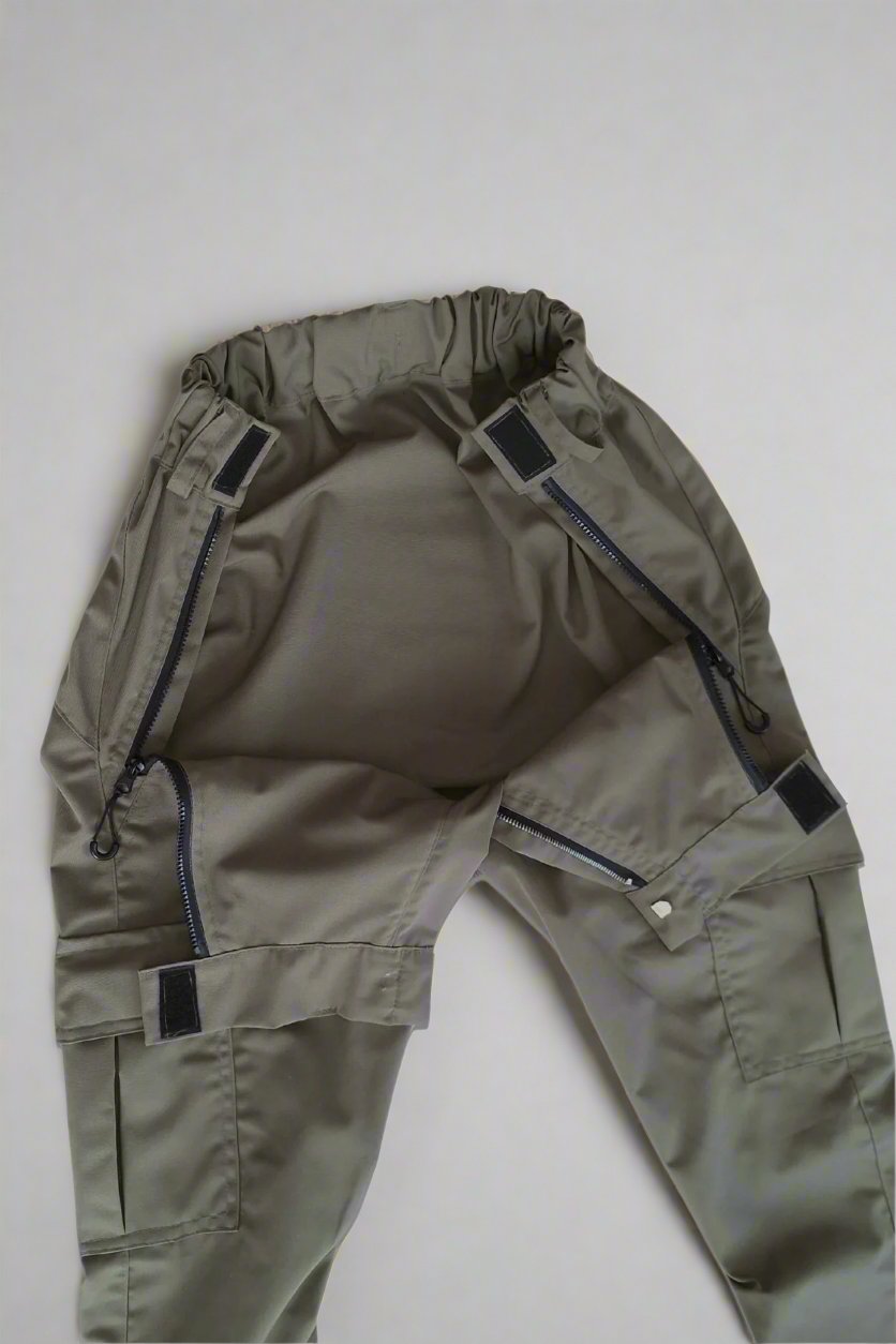 wheelchair adaptive trousers lying flat on surface opened front panel shown